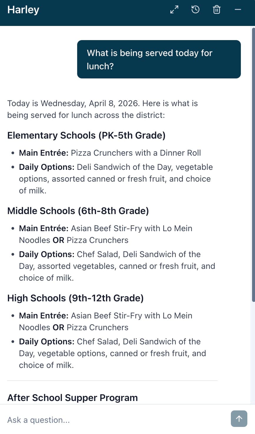 Harley answering "What is being served today for lunch?" with full menus by grade level